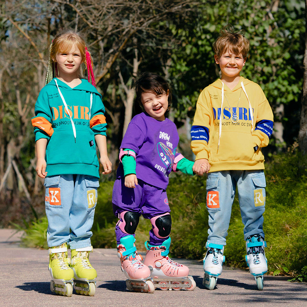 Children wearing Cooghi roller skates