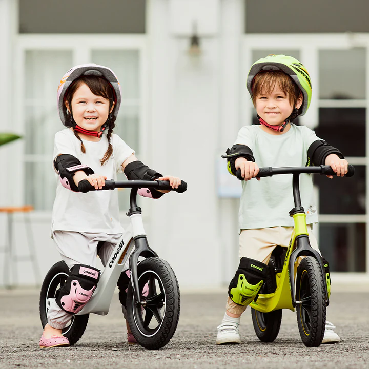 Boys and girls riding Cooghi S3 baby balance bike